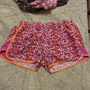 Under Armour size Large pink/orange running shorts